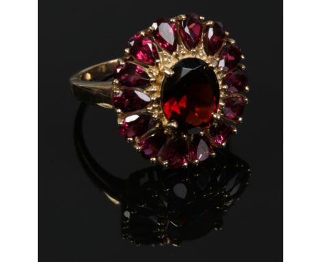 A 9ct gold and garnet cluster ring with certificate, size N.