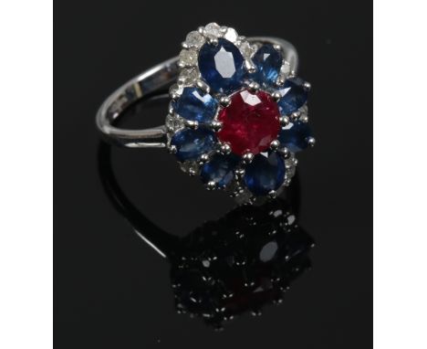 A 9ct white gold sapphire, ruby and diamond cluster set dress ring, size N.