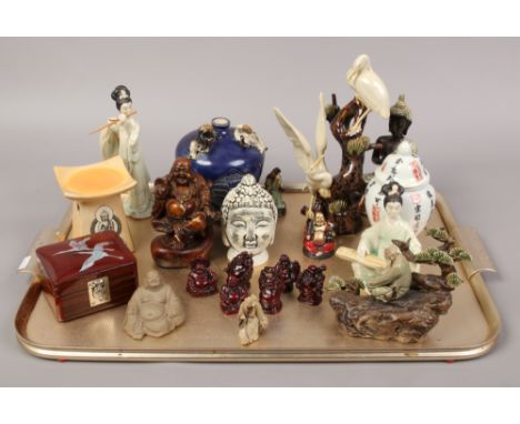 A tray lot of oriental wares to include ceramic figures, Buddhas, lidded vase etc.