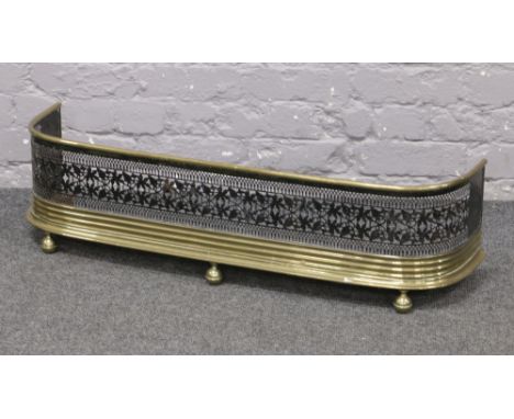 A Victorian pierced brass and steel nursery fire fender.