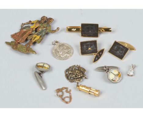 A quantity of cufflinks and pin badges including 24ct gold plated examples, along with a miners lamp, charm etc.