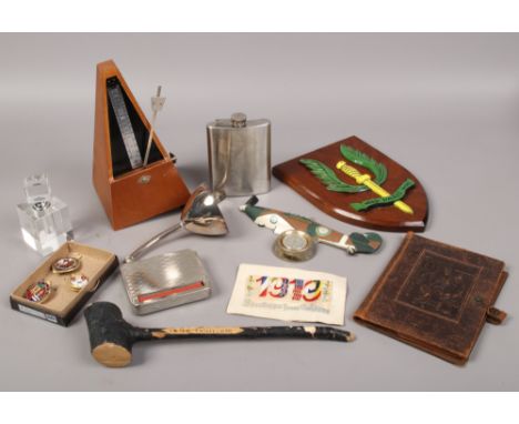 A box of collectables to include railway badges, hip flask, Irish Shillelagh etc.