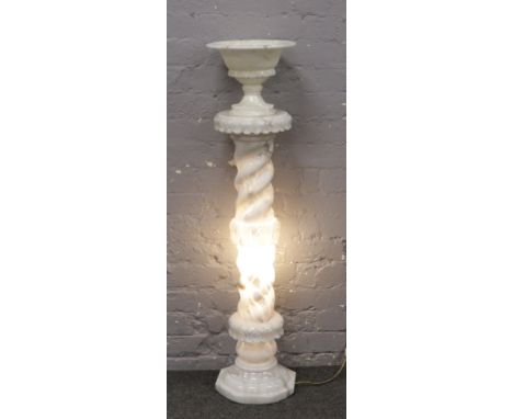 An illuminating alabaster torchere stand and matching pedestal urn.