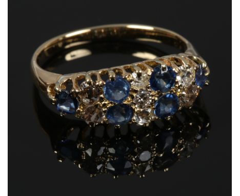 An 18ct gold 13 stone sapphire and diamond ring, size M.