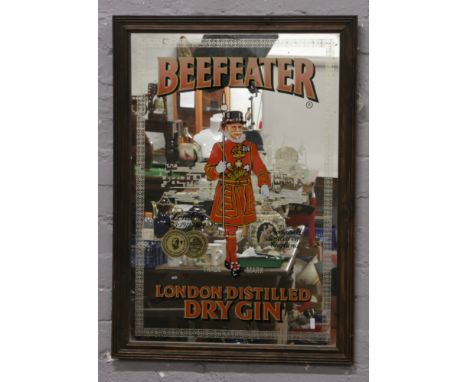 A framed Beefeater London distilled dry gin advertising mirror.