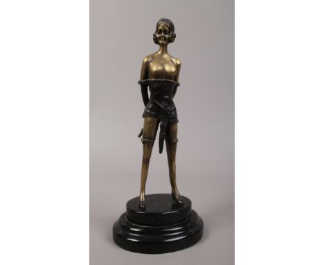 A decorative bronze of a semi clad female, signed F. Preiss raised on stepped marble base.
