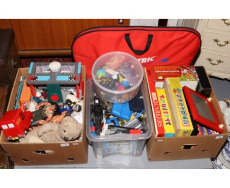 Three boxes of children's toys to include Action Man figures, My First Scalextric, Etch a Sketch, boxed games etc.