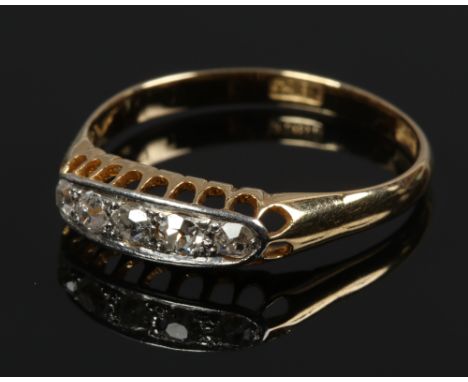 An 18ct gold five stone diamond ring in boat shaped setting, size P.