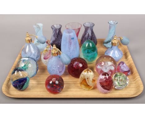 A tray of coloured glass art vases, paper weights and perfume atomisers to include Caithness examples.