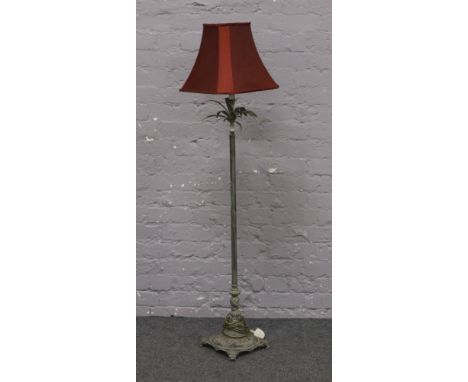 A decorative iron effect standard lamp.