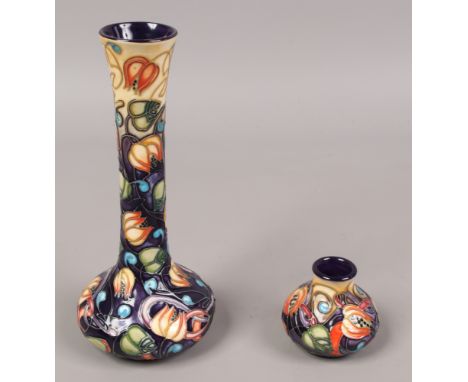 Two Moorcroft vases in the Celtic Web design including a squat example along with a bottle vase, tallest 20cm.Condition repor