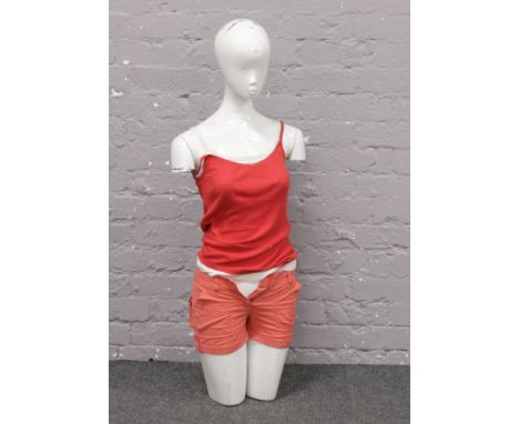 A shop mannequin head and torso.