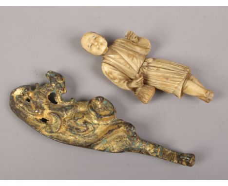 An antique Chinese gilt bronze belt hook and a Japanese Meiji period ivory figure (AF).