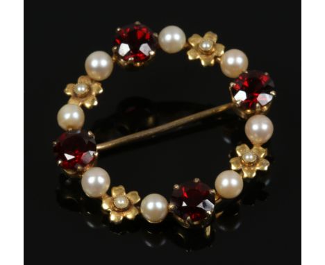 A 9ct gold garnet and pearl wreath brooch.