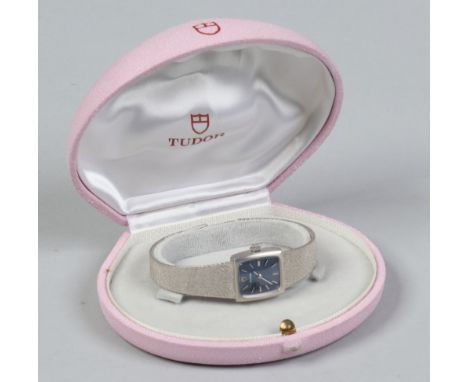 A cased 9ct white gold manual Tudor wristwatch with baton markers. (Gross weight 30g).
