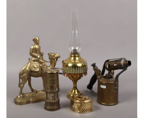 A group lot of brassware to include General Gordon miners lamp, decorative oil lamp etc.