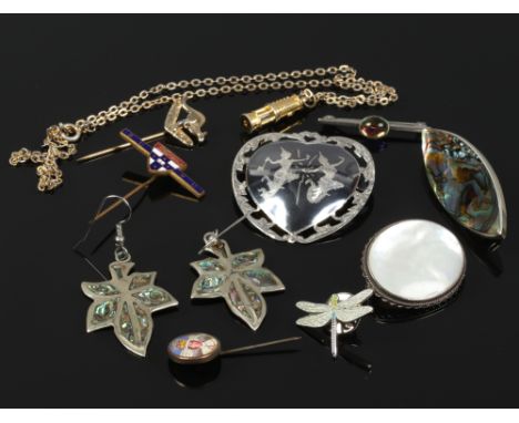 A quantity of silver and white metal brooches and earrings including mother of pearl and niello set examples.