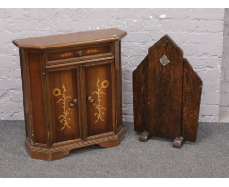 An Art Deco oak firescreen and a marquetry side cabinet.