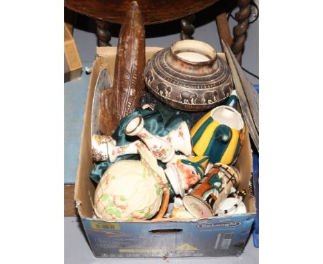 A box of miscellaneous including ceramics, bisque doll, African carved figure and a street lamp.