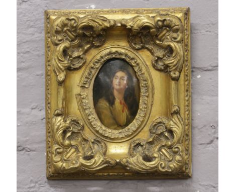 An ornate gilt framed oil on board of a young girl, signed M. Pauly.