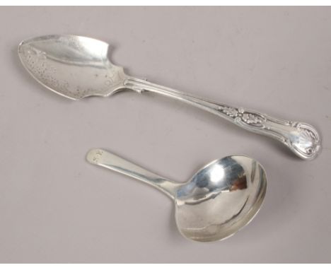 A Georgian silver caddy spoon, along with a silver jam spoon.