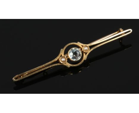 A cased 15ct gold aquamarine and seed pearl bar brooch.