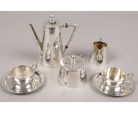 An Art Deco Czechoslovakian silver coffee set including coffee pot, sucrier cream jug and two duos, the coffee pot having car