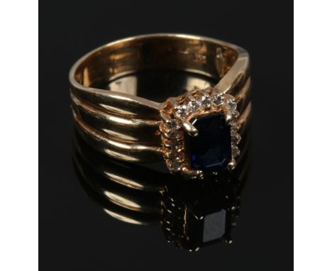 A 14ct gold sapphire and diamond engagement ring, size N.