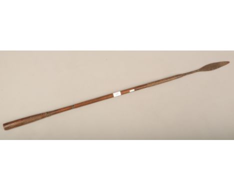 An African tribal hunting spear with carved shaft.
