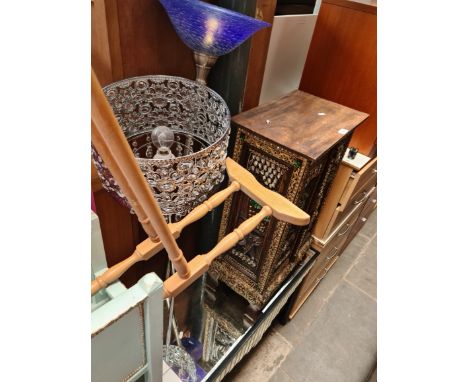 A mirrored glass side table and two modern metal standard lamps. 