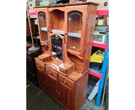 A pine dresser and a pine dressing table mirror 