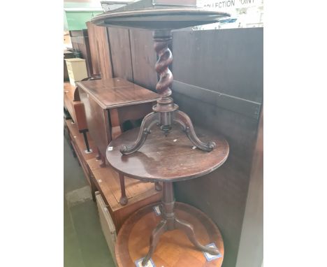 A Georgian snap top mahogany tripod table and a 19th century mahogany tripod table with twist support. 