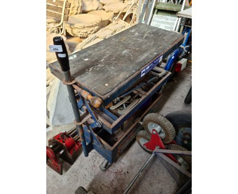 A cantilever garage tool trolley with tools.