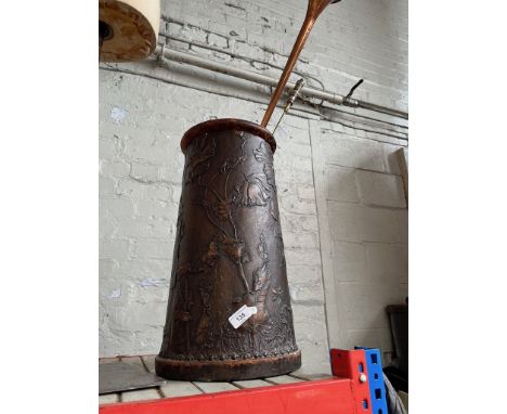 An embossed leather stick stand decorated with Art Nouveau style flowers and contents including a post horn and a toasting fo