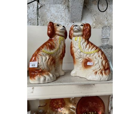A pair of ceramic spaniels, by L. Bentley. 
