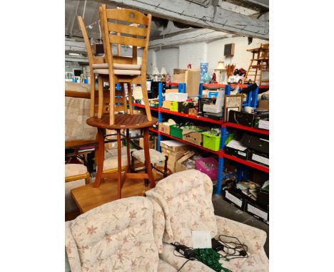 A pair of electric reclining armchairs, a table and four chairs, a stool and a teak garden table. 