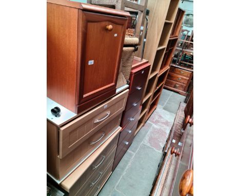 A teak bedside cabinet, two light wood effect chests of drawers, two wooden stools, a chrome and black vinyl stool and two wo