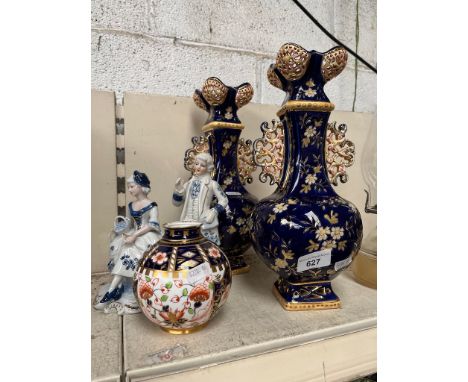 A parcel lot comprising a pair of Zsolnay style vases numbered 194, a Royal Crown Derby vase and a pair of porcelain figures.