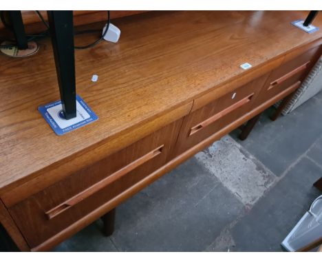 A mid 20th century teak dressing table/ sideboard, length 152cm. 