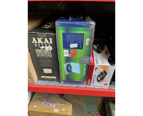 A portable Akai record player, an Ion portable record player and Tevion USB record player. 