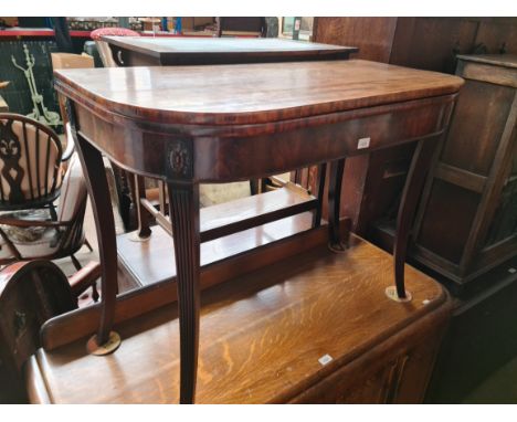 A George III fold top mahogany tea table with sabre legs, width 100cm. 