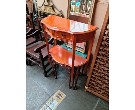 A nest of tables and a console table. 