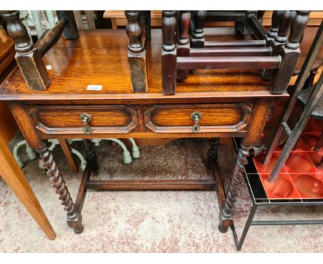 An oak twist legs table with drawer.