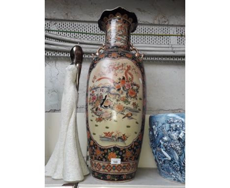 A large modern Chinese vase with handles in shape of birds. 