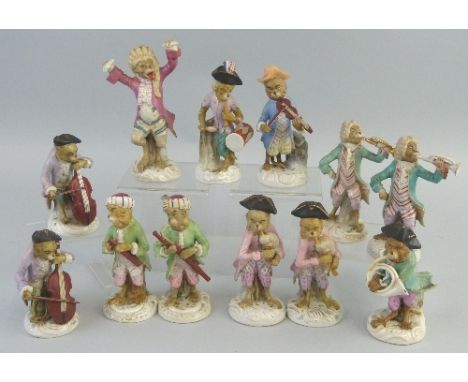 Twelve German monkey bandsmen, comprising conductor, three playing stringed instruments, drummer and seven playing wind instr