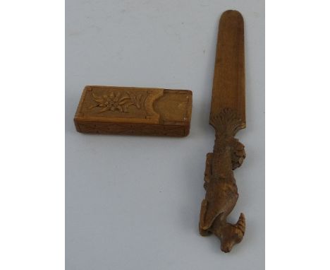 A Black Forest walnut letter opener, the handle carved as a reclining deer, 24.5cm long and a Black Forest carved walnut trav