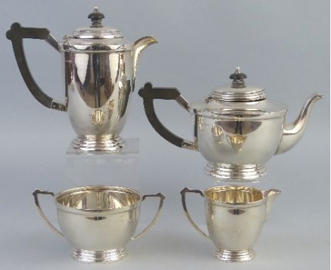 A four piece tea and coffee set, the circular teapot with ebonised finial on stepped hinged lid, similar scroll loop handle, 