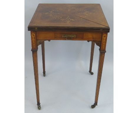 An Edwardian rosewood envelope card table, with satinwood stringing, the floral inlaid hinged four piece top opening to revea
