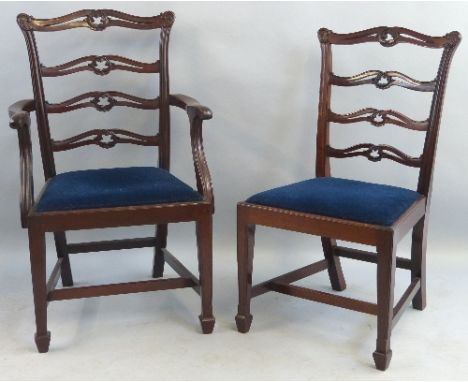 A set of six mahogany dining chairs, including two elbow chairs, Chippendale style with pierced and arched ladder back, on li