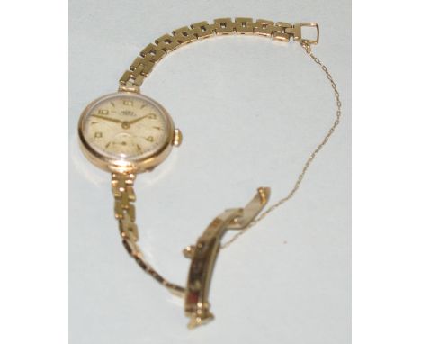A lady's wristwatch by Trebex, the manual wind movement having circular dial with Arabic numerals and subsidiary seconds dial